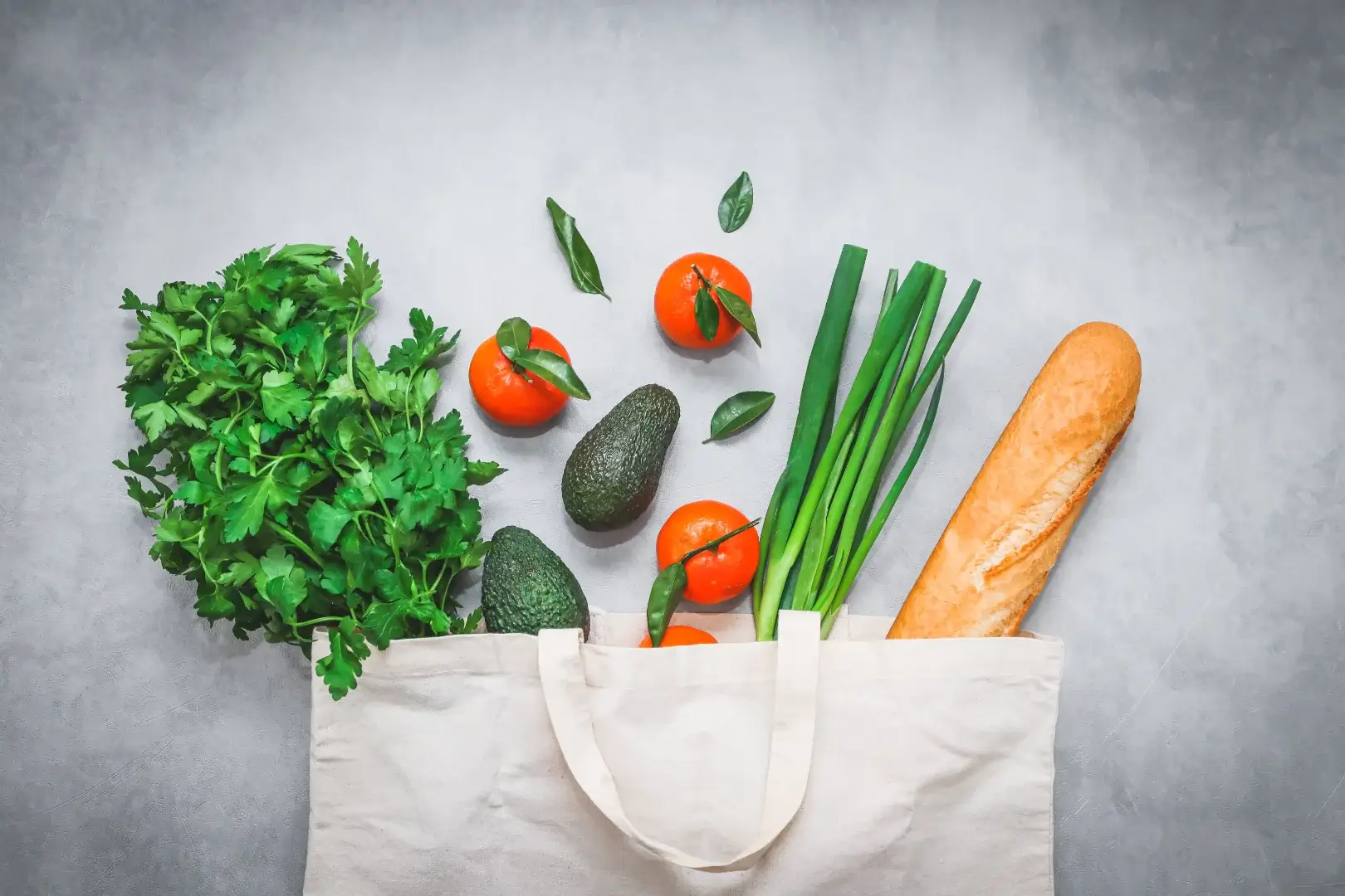 A reusable shopping bag filled with fresh groceries